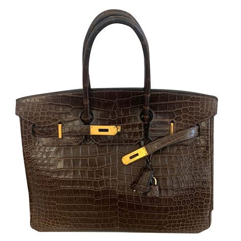 hermes bag black and gold alligator vintage|Hermes birkin alligator bag price.